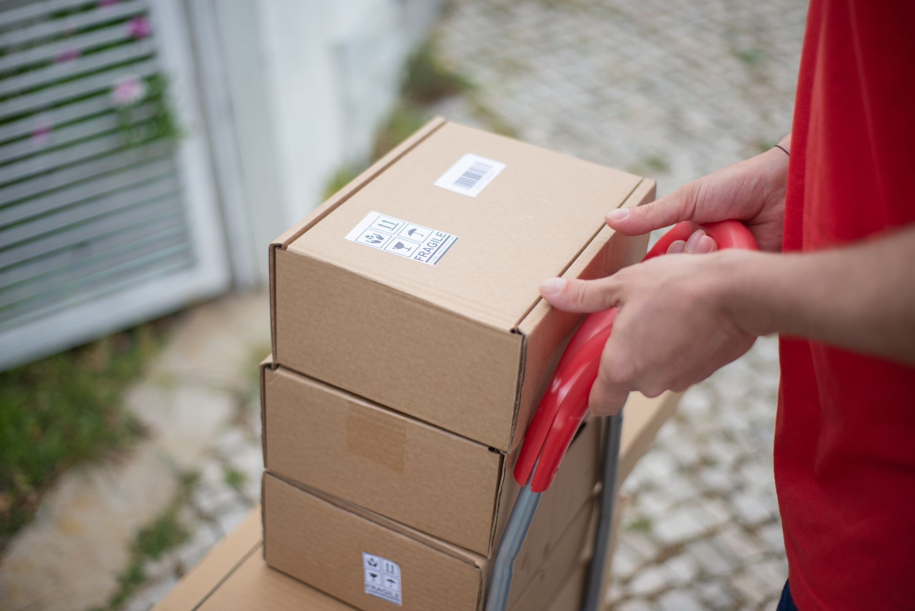 Cartons stacked on a hand trolley